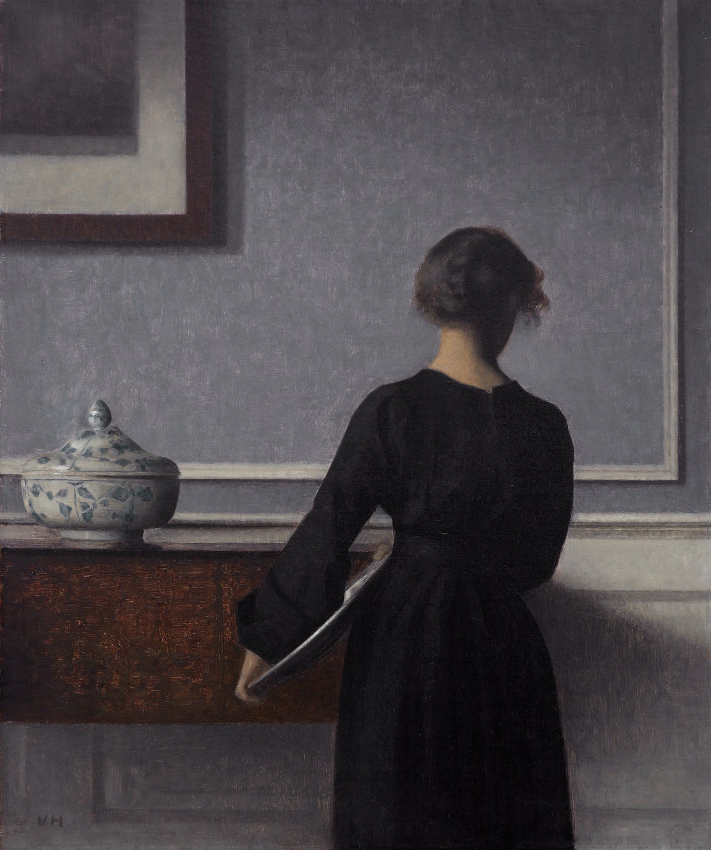 Interior com jovem vista de costas - Vilhelm Hammershoi
